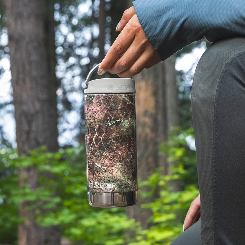 12oz-tkwide-with-twist-cap-mossy-oak-c8 12oz_tumbler_mossyoak_rainbowtrout_hand_closeup_square.jpg