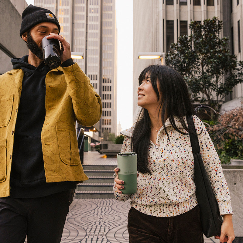 16oz-rise-tumbler-d8 16oz_rise_tumbler_black_iceberg_couple_drink_city_street_square.jpg