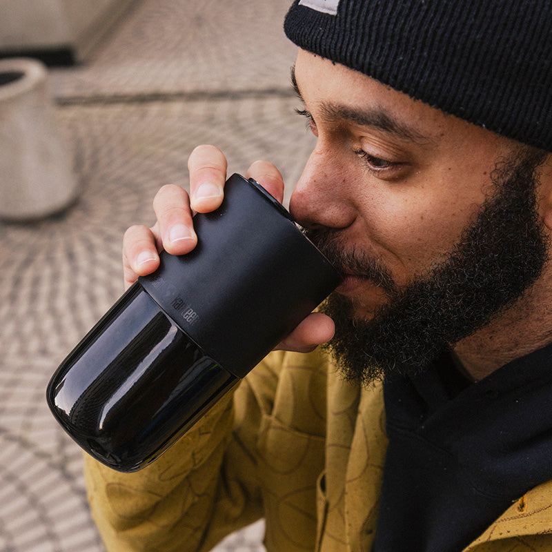 daily-on-the-go-set-l0 16oz_rise_tumbler_black_man_drink_square.jpg
