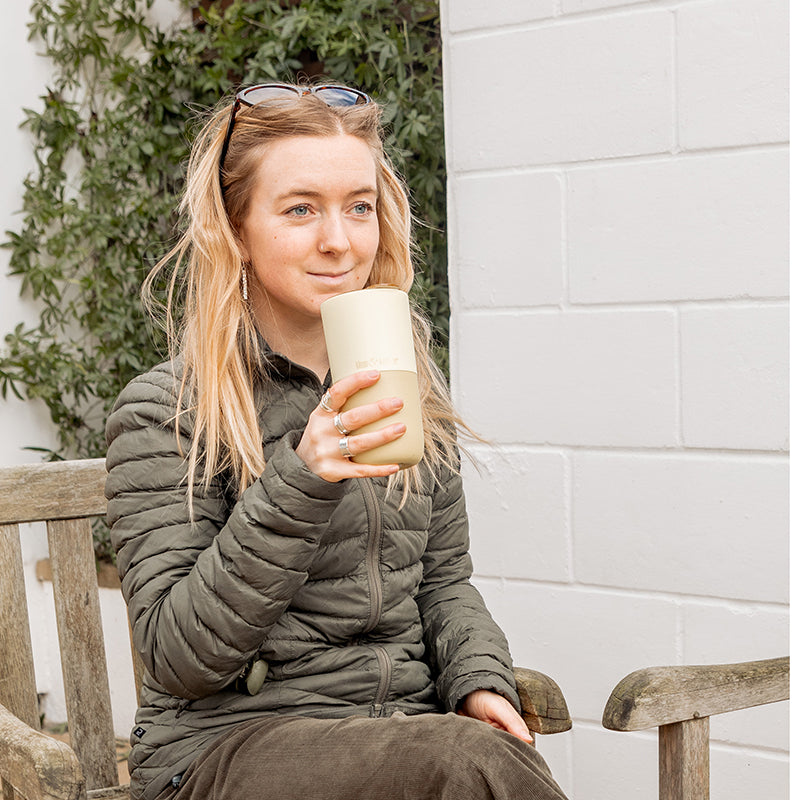 16oz-rise-tumbler-d8 16oz_rise_tumbler_wax_yellow_woman_seat_outside_square.jpg