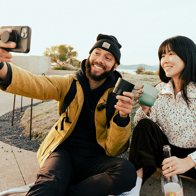 bring-your-own-party-kit-tumblers-and-cocktails-u0 8oz_rise_lowball_black_iceberg_couple_selfie_city_square.jpg