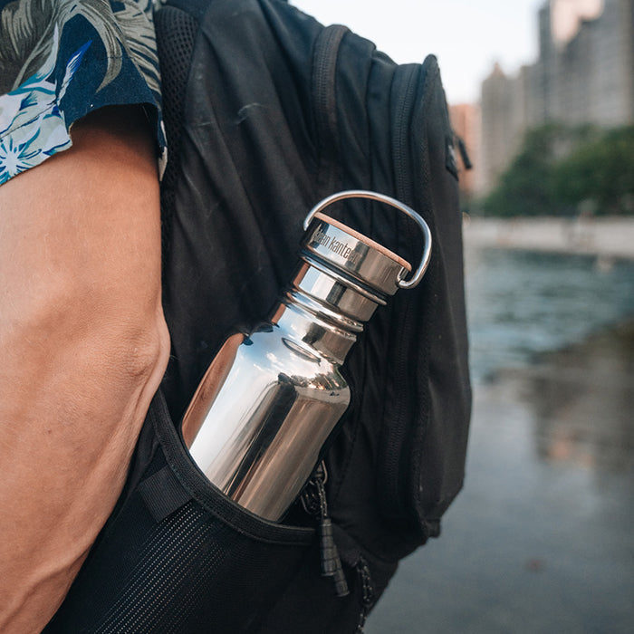 27oz-reflect-with-bamboo-cap-x2 K27SSLRF-MS-BAMBOO_reflect-bottle_backpack_lifestyle.jpg
